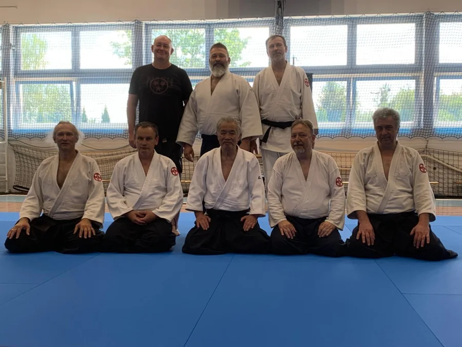 Tomasz Kuszewicz smiling with a fellow martial artist
